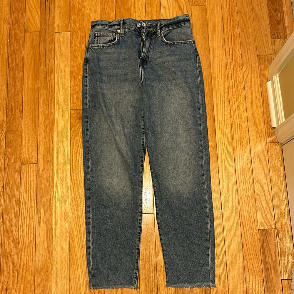 Like new Forever 21 medium wash jean with raw hem. Size 27. Perfect for school!